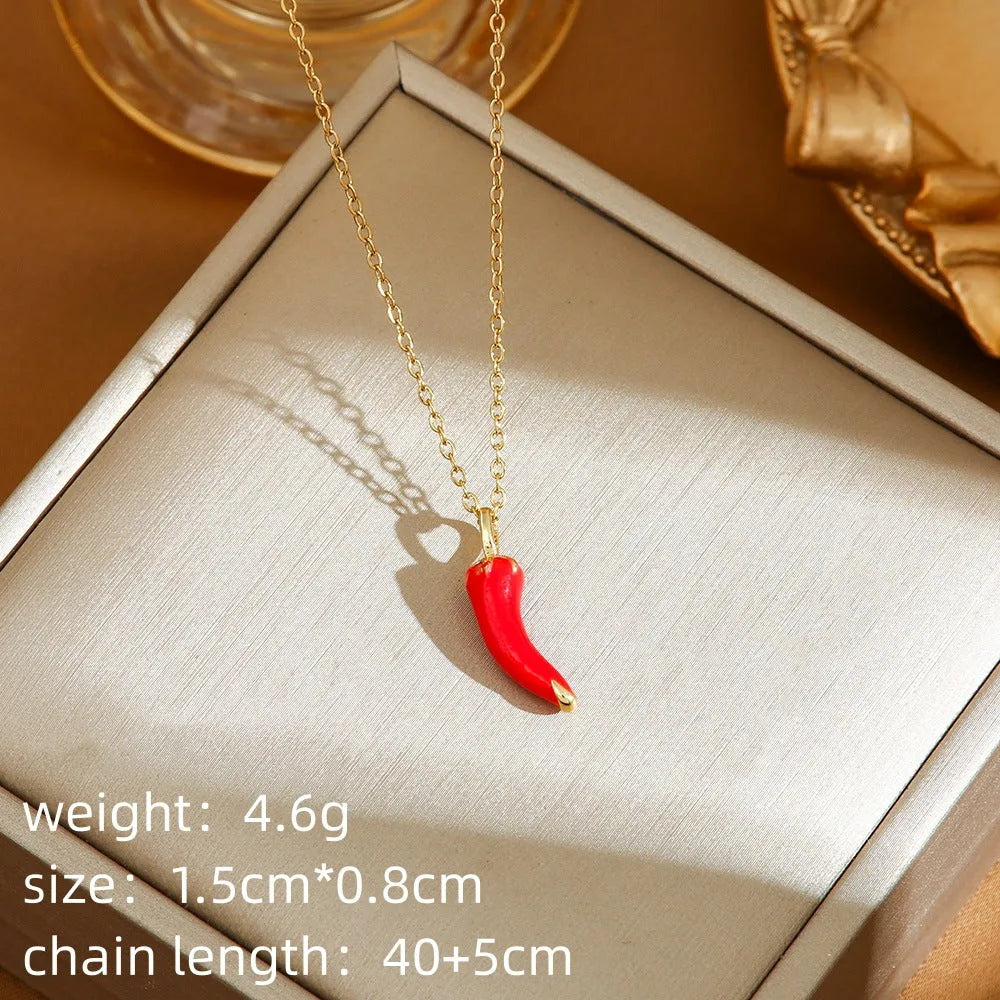 Delicate titanium steel necklace with a small cherry charm on an O-ring chain, gold finish.