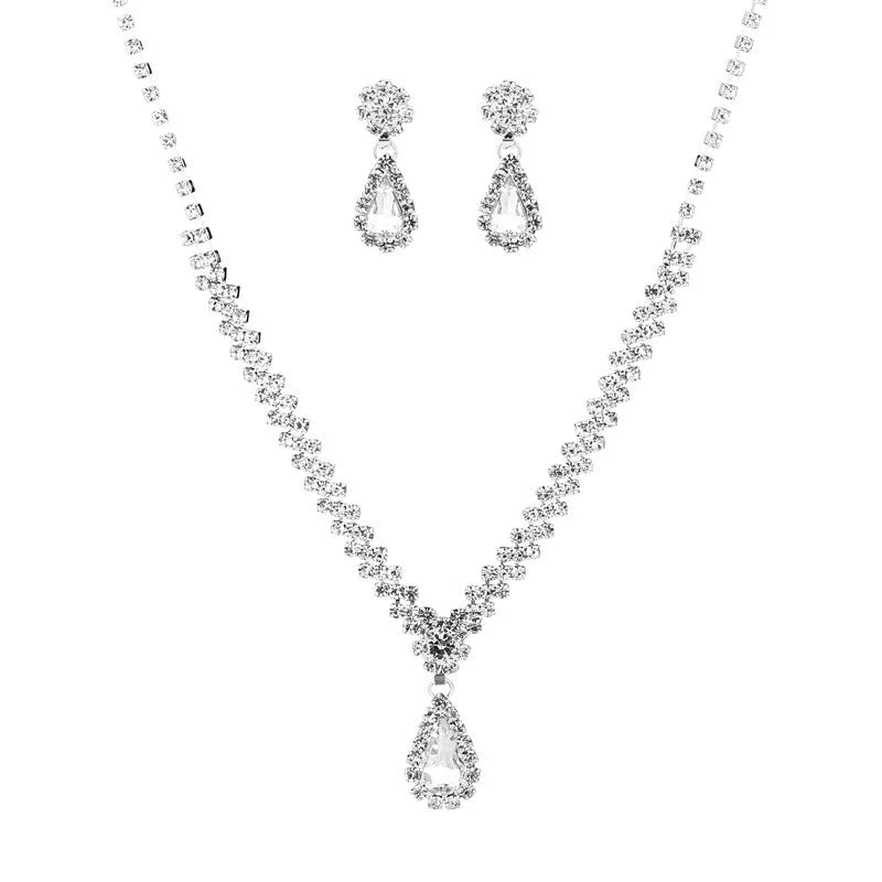 Claw chain necklace and matching earrings set with drop-shaped rhinestones in blue colour