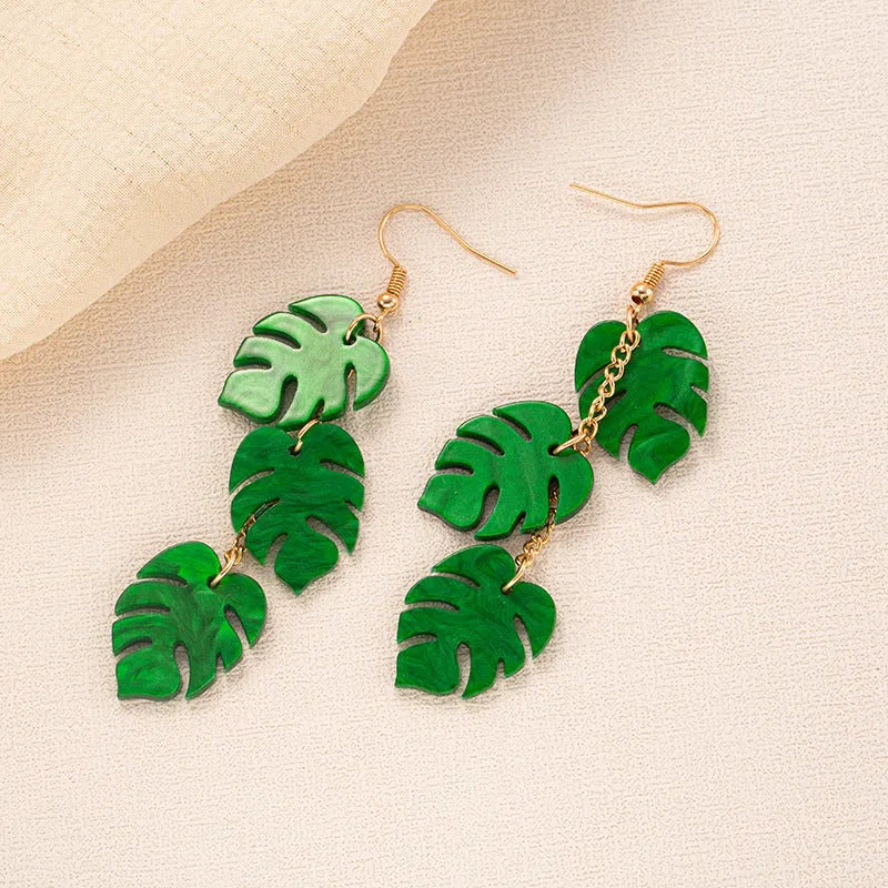 Pair of women's hook earrings with a green and yellow acrylic jackfruit drop decoration on a gold-toned alloy hook.