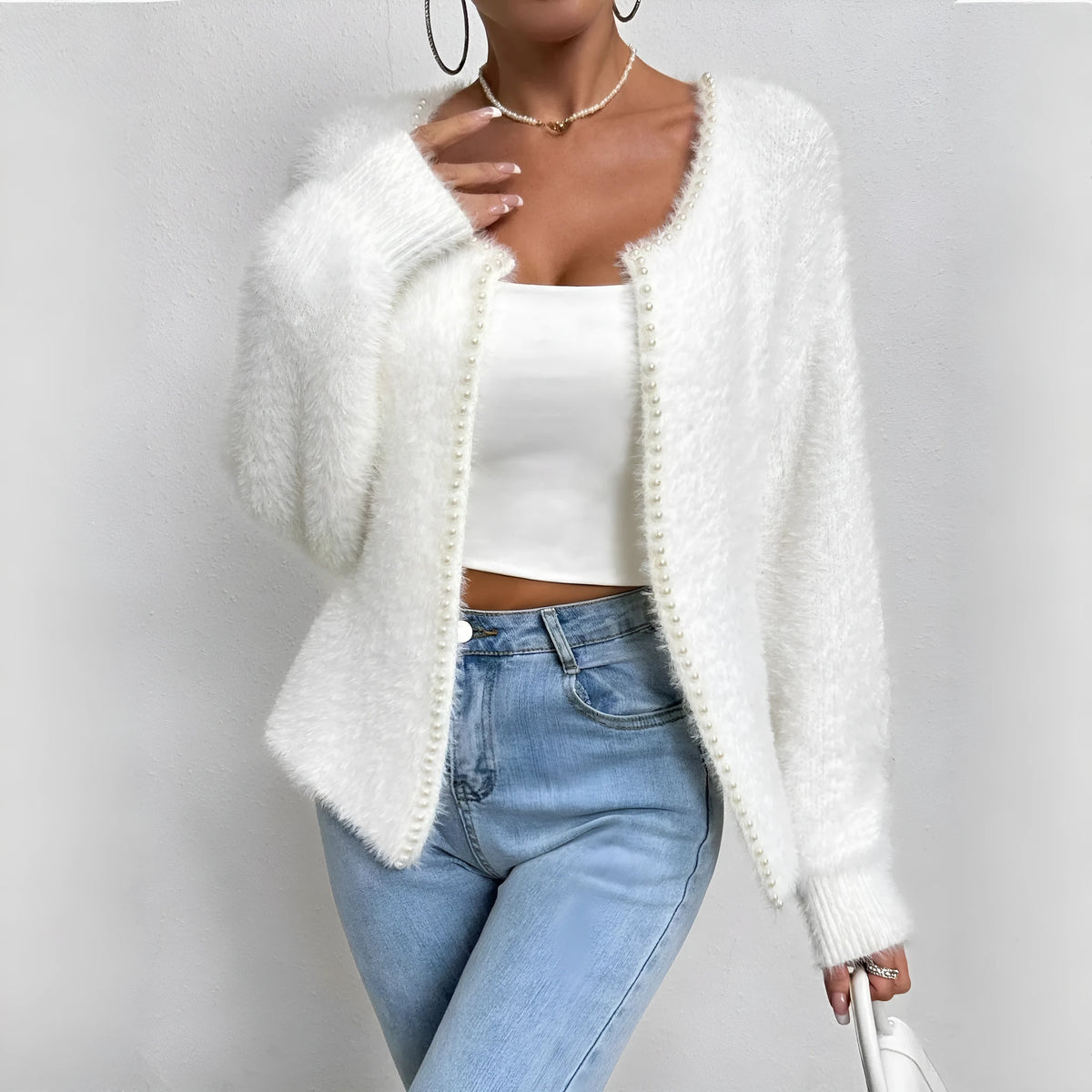 White women's V-neck cardigan with bead knit texture on polyester fabric