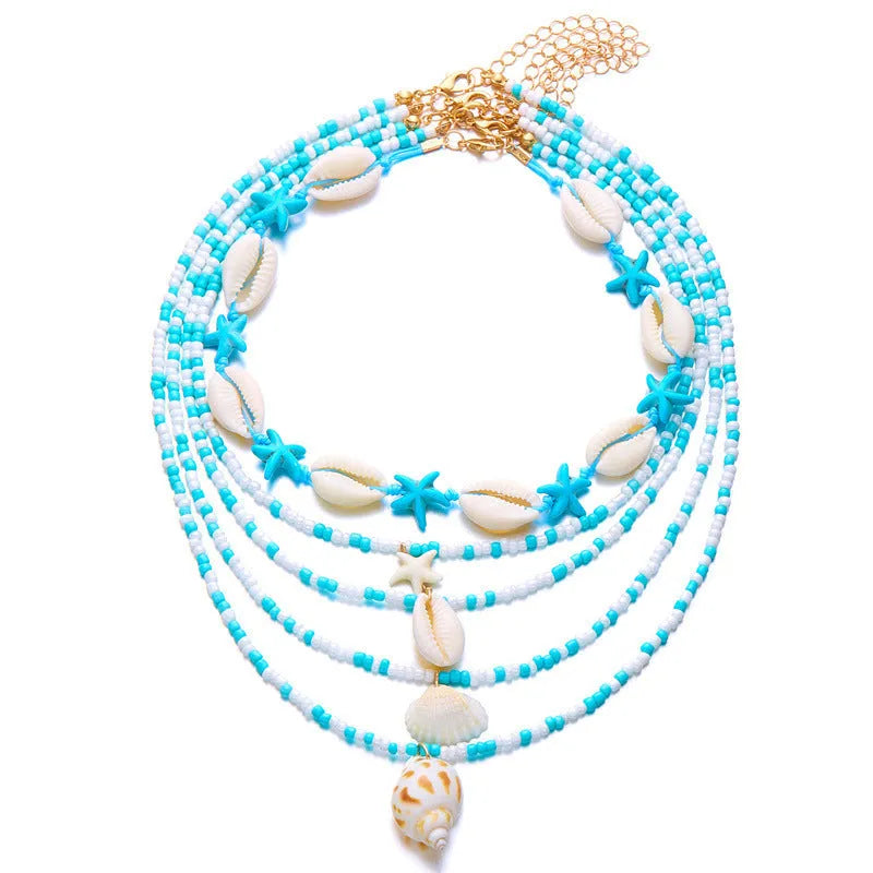 Blue and coloured multi-layer women's necklace set with starfish, shell, and conch beads on adjustable chain.