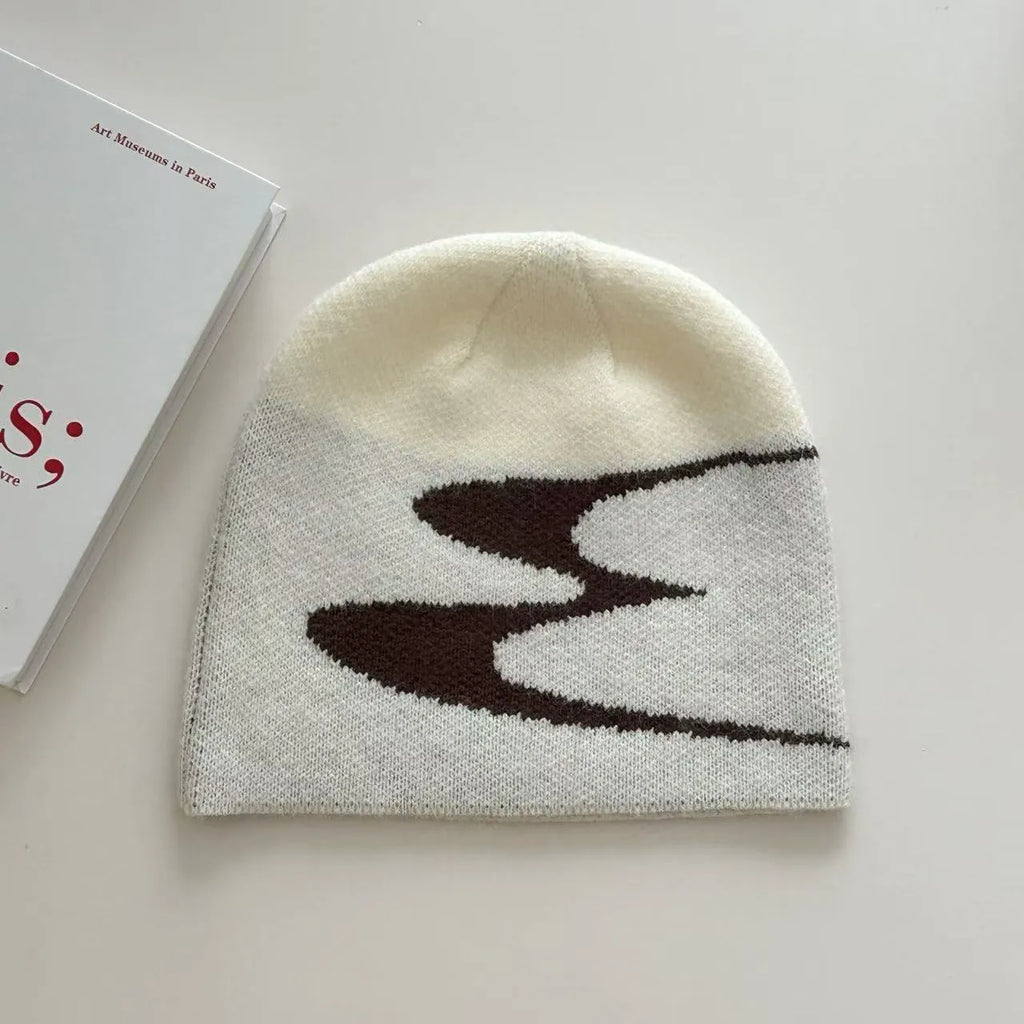 A knitted acrylic beanie hat in medium size, shown in black, grey, and white colour options.