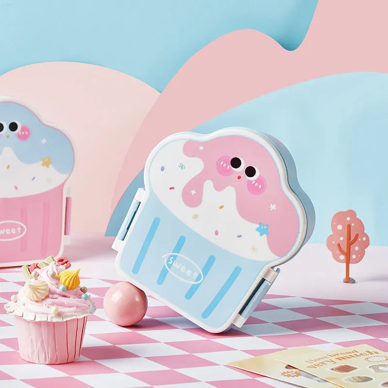 Pink and blue creative ice cream shaped plastic lunch box with spoon and fork on a white background.