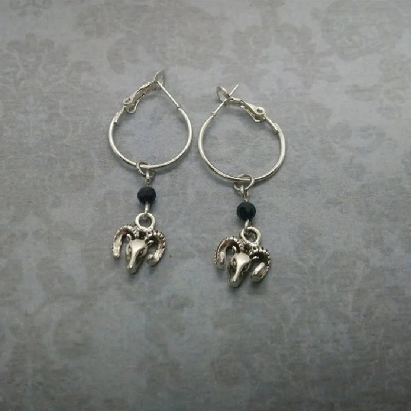 Silver Tibetan antelope round ring earrings for women with Yunnan high altitude inspired design
