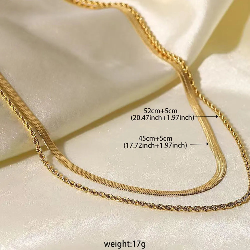 Women's double-layer twist necklace with geometric titanium steel pendant on an adjustable snake bone chain.
