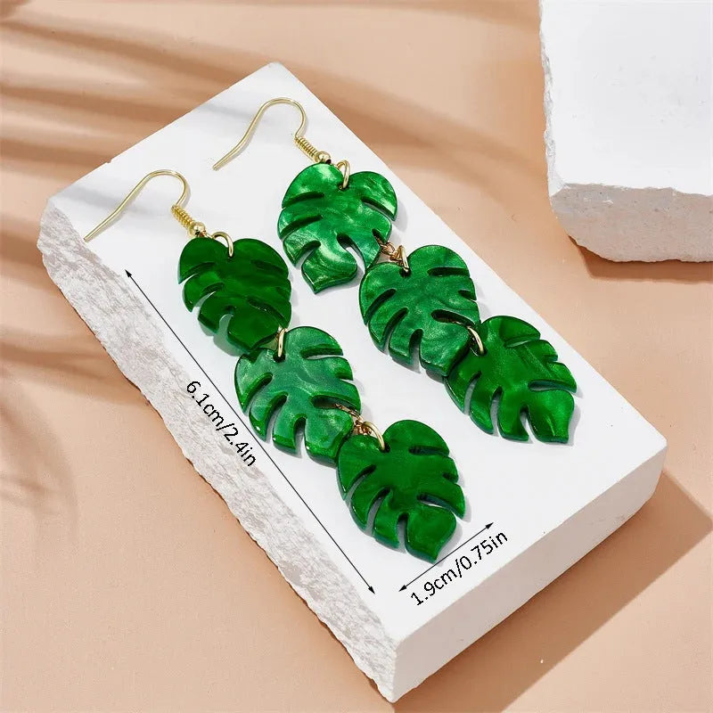 Pair of women's hook earrings with a green and yellow acrylic jackfruit drop decoration on a gold-toned alloy hook.
