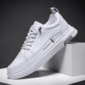 Men's low-top white skateboard shoes with elastic band closure and rubber sole