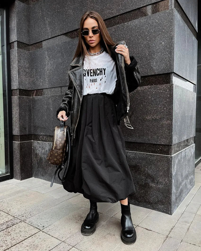 Women's cotton long skirt in solid black colour showing full length design