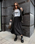 Women's cotton long skirt in solid black colour showing full length design
