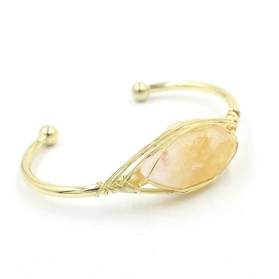 Natural raw gemstone winding crystal bracelet showing simple opening design and amorphous 8mm shape