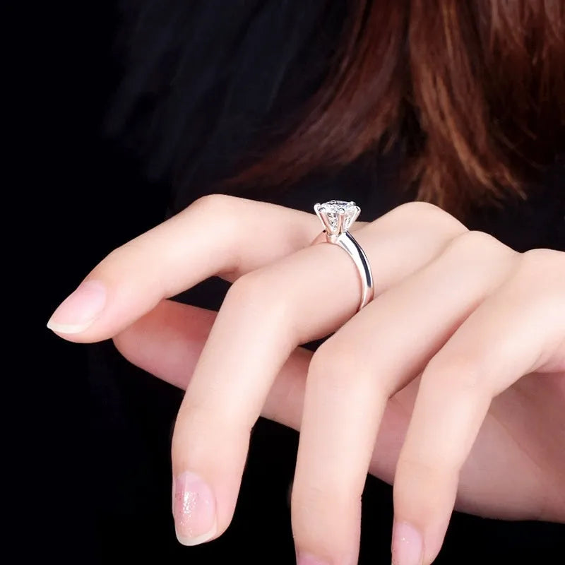 Six-claw set zircon ring with geometric design and white gold plated finish on white copper