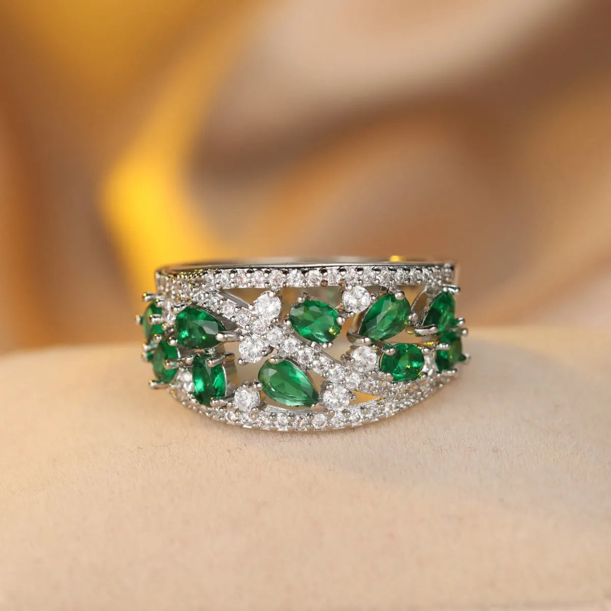 Copper hollow fashion ring for women in a round design, shown in gold and platinum with blue and white stone accents.