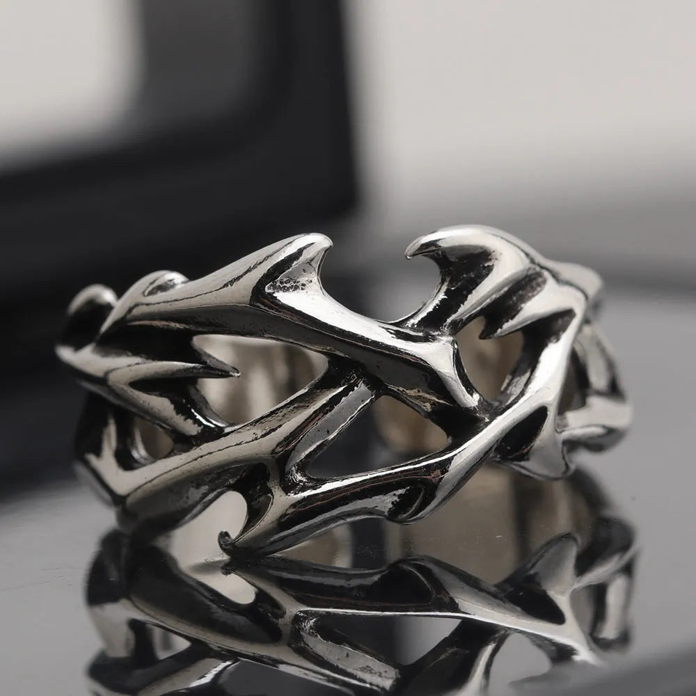 Copper men's ring with geometric thorn flower design and adjustable band in J2150 colour.