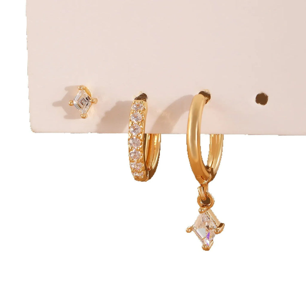 Ladies three-piece jewellery set with geometric patterns and zircon accents in gold and white colours