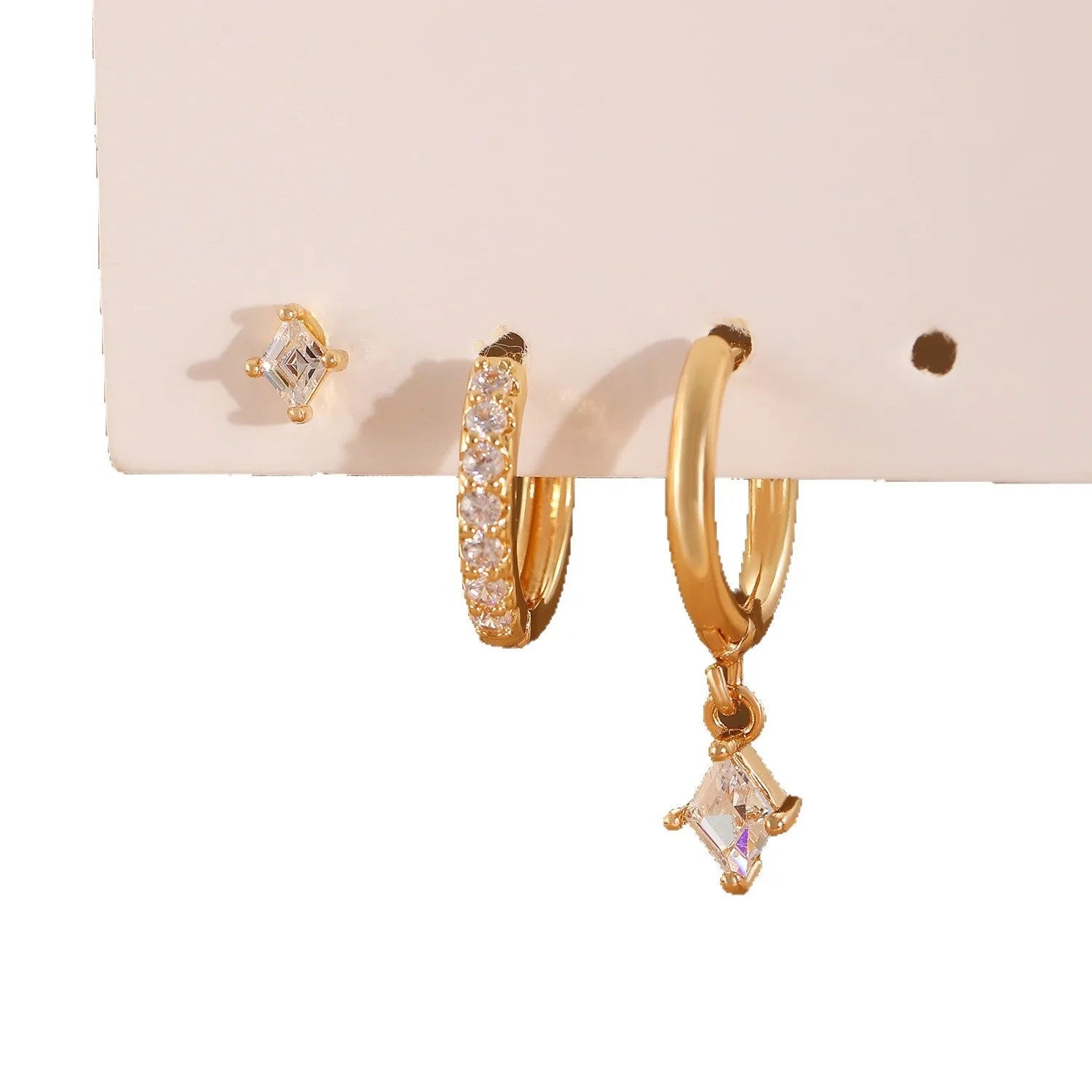 Ladies three-piece jewellery set with geometric patterns and zircon accents in gold and white colours