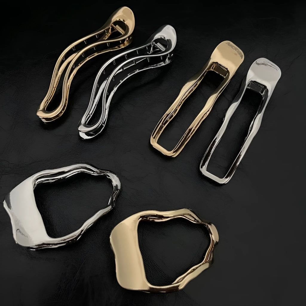 Women's zinc alloy hair barrettes in gold and silver colours showing square, arc, and triangle shapes
