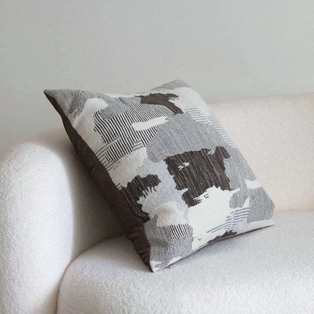 Coffee brown striped mid-ancient Chinese style decorative pillow cushion on a sofa.