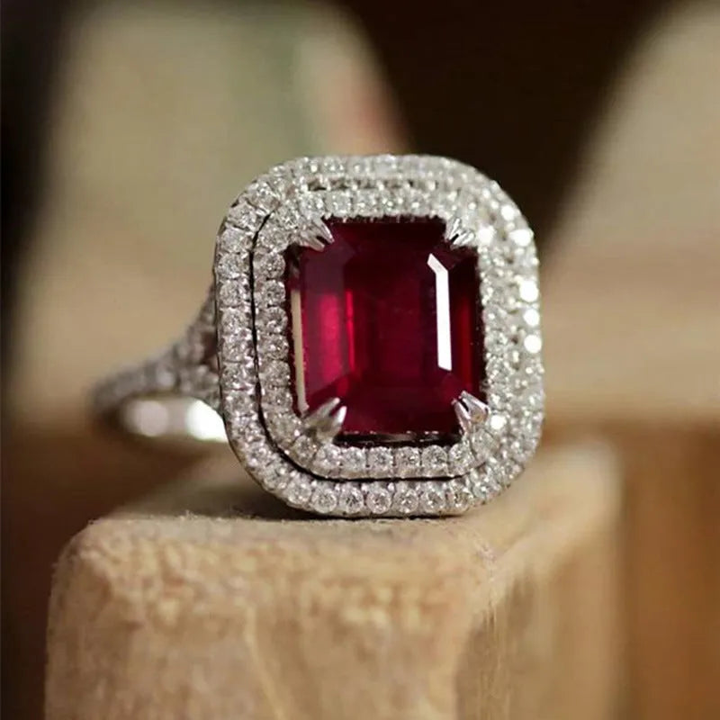 Copper geometric square ring with red rhinestones for women, showing structured design and sparkling accents