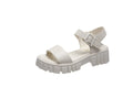 Beige women's peep toe platform sandals with an ankle-strap buckle on a white background.