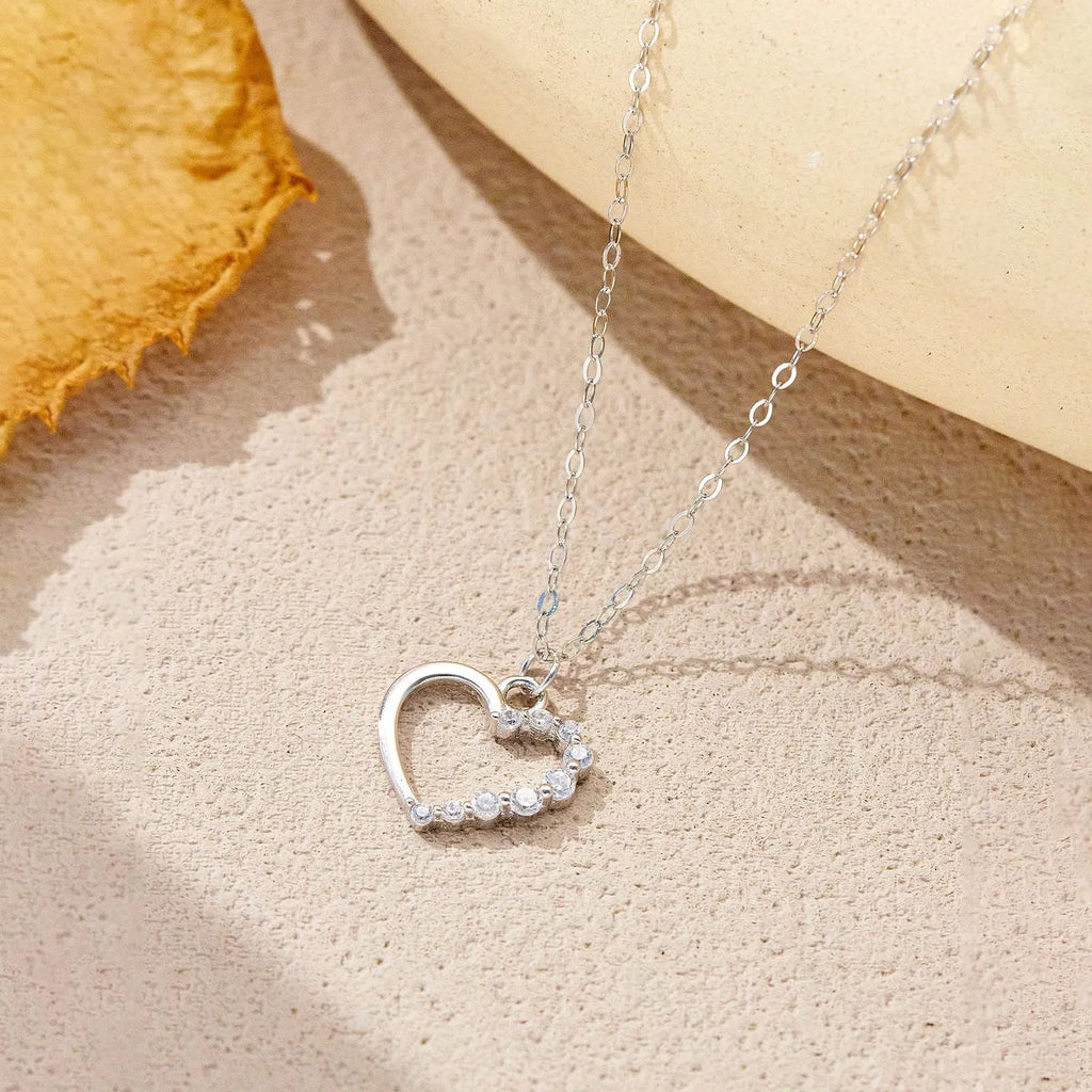S925 sterling silver hollow heart pendant necklace on a regular chain.