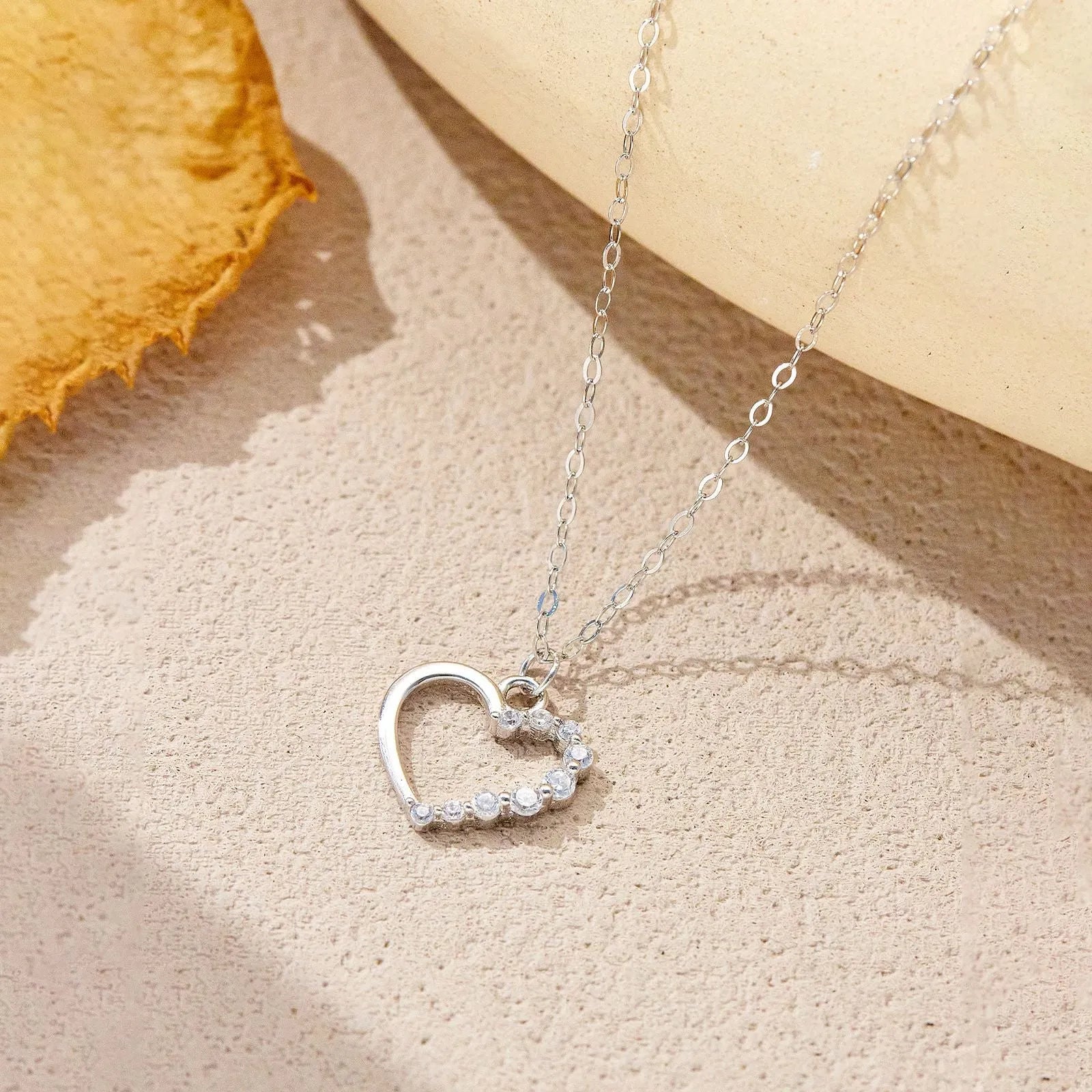 S925 sterling silver hollow heart pendant necklace on a regular chain.