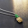 Silver geometric pineapple necklace with diamond-style stones on model
