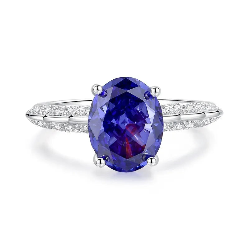 Heart-shaped sterling silver ring with a faceted ice flower cut zircon stone in a Tanzanite colour.