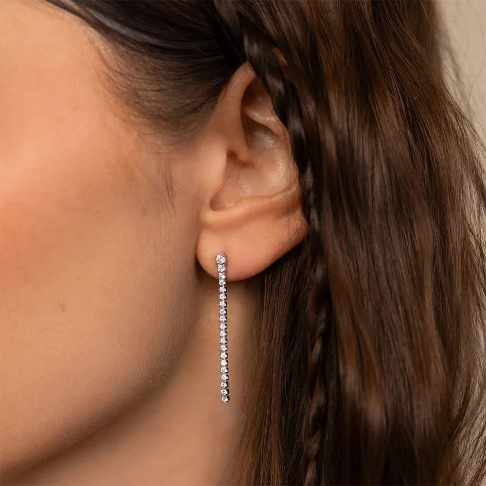 A pair of women's geometric stainless steel earrings with zircon detail in gold and steel colour options.