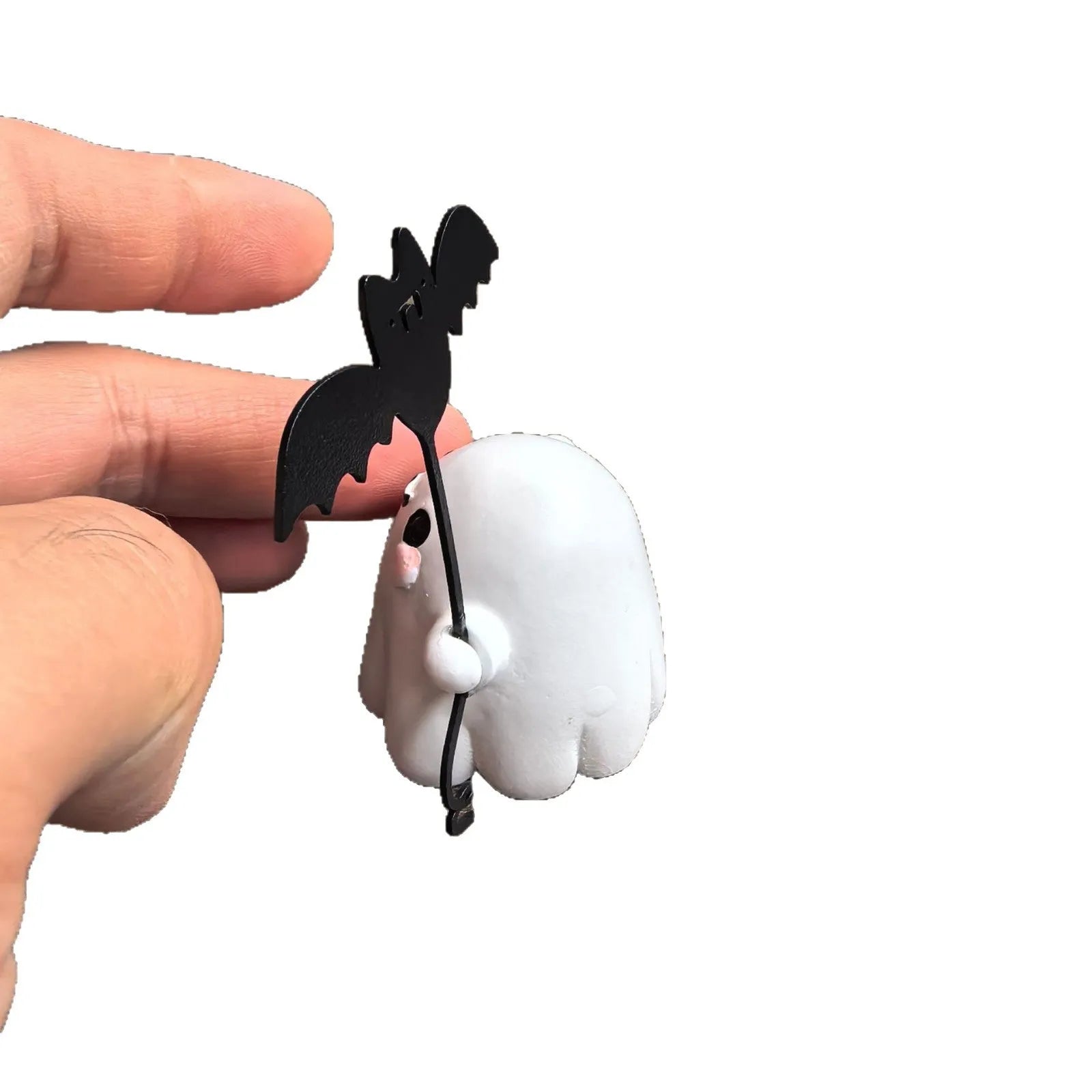 Small resin Halloween statue of a ghost walking a dog and holding a bat.