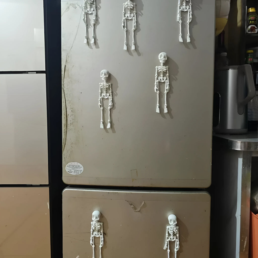 3D printed Halloween skull ornament in multiple colours displayed as fridge magnet
