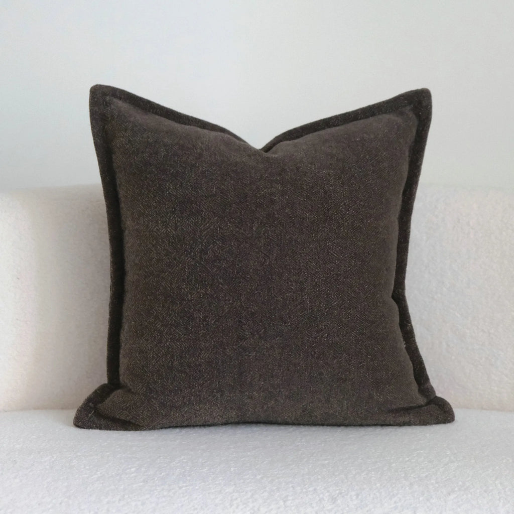 Coffee brown striped mid-ancient Chinese style decorative pillow cushion on a sofa.