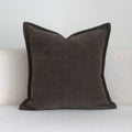 Coffee brown striped mid-ancient Chinese style decorative pillow cushion on a sofa.