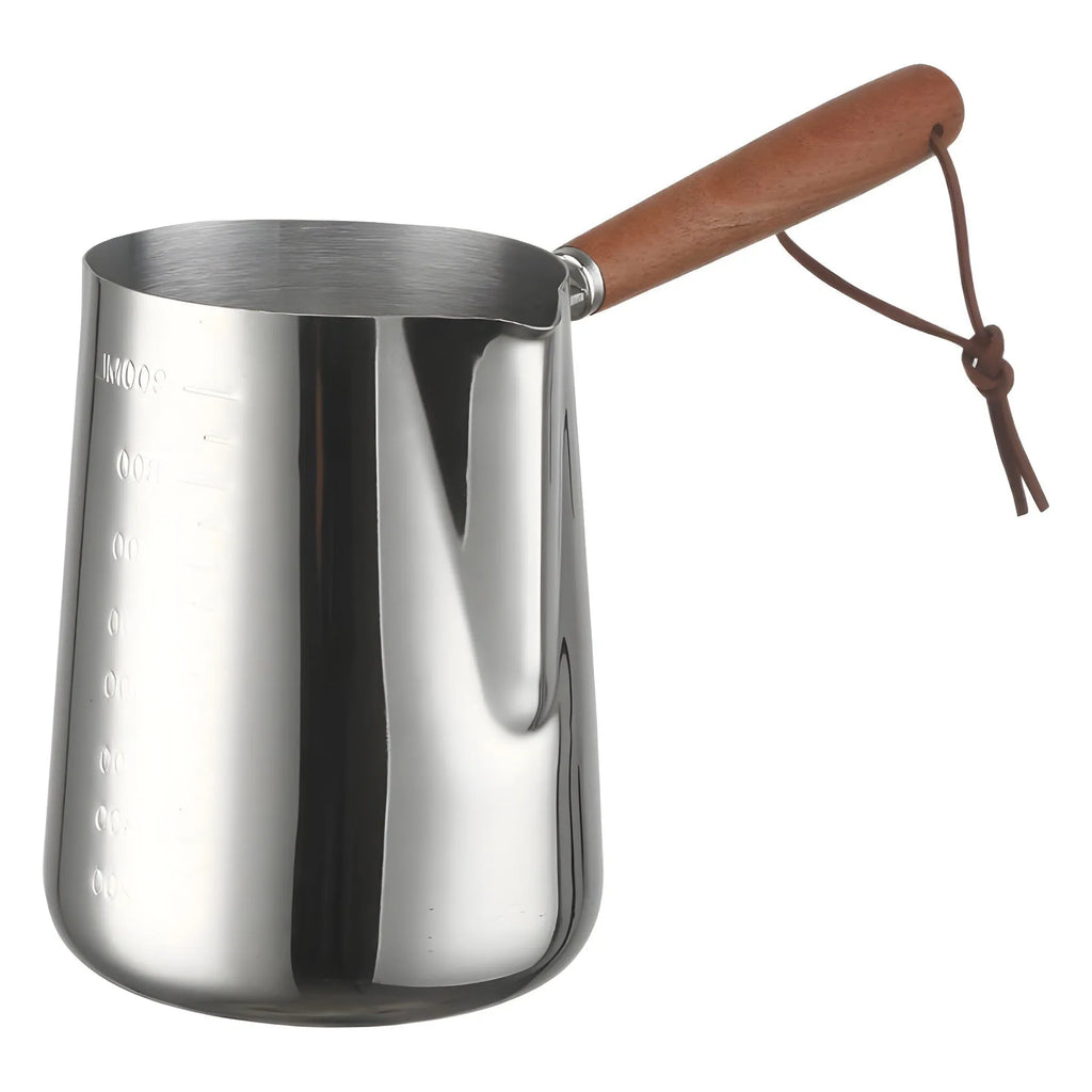 Stainless steel milk jug with measurement scale and wooden handle for barista latte art.