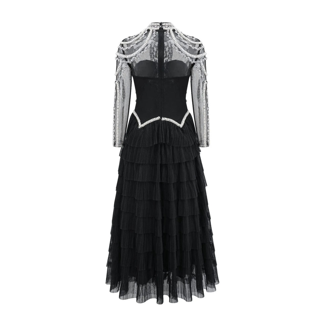 Women's long sleeve black beaded evening dress with a fitted mid waist.