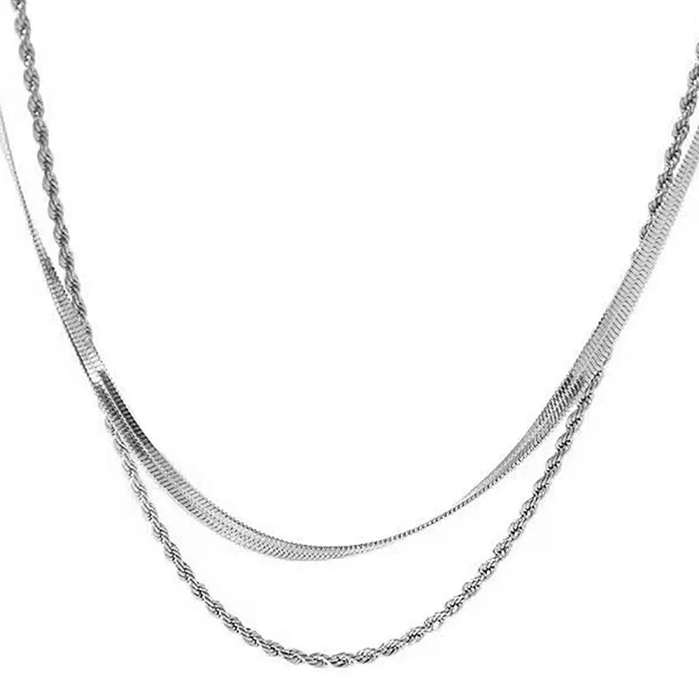 Women's double-layer twist necklace with geometric titanium steel pendant on an adjustable snake bone chain.