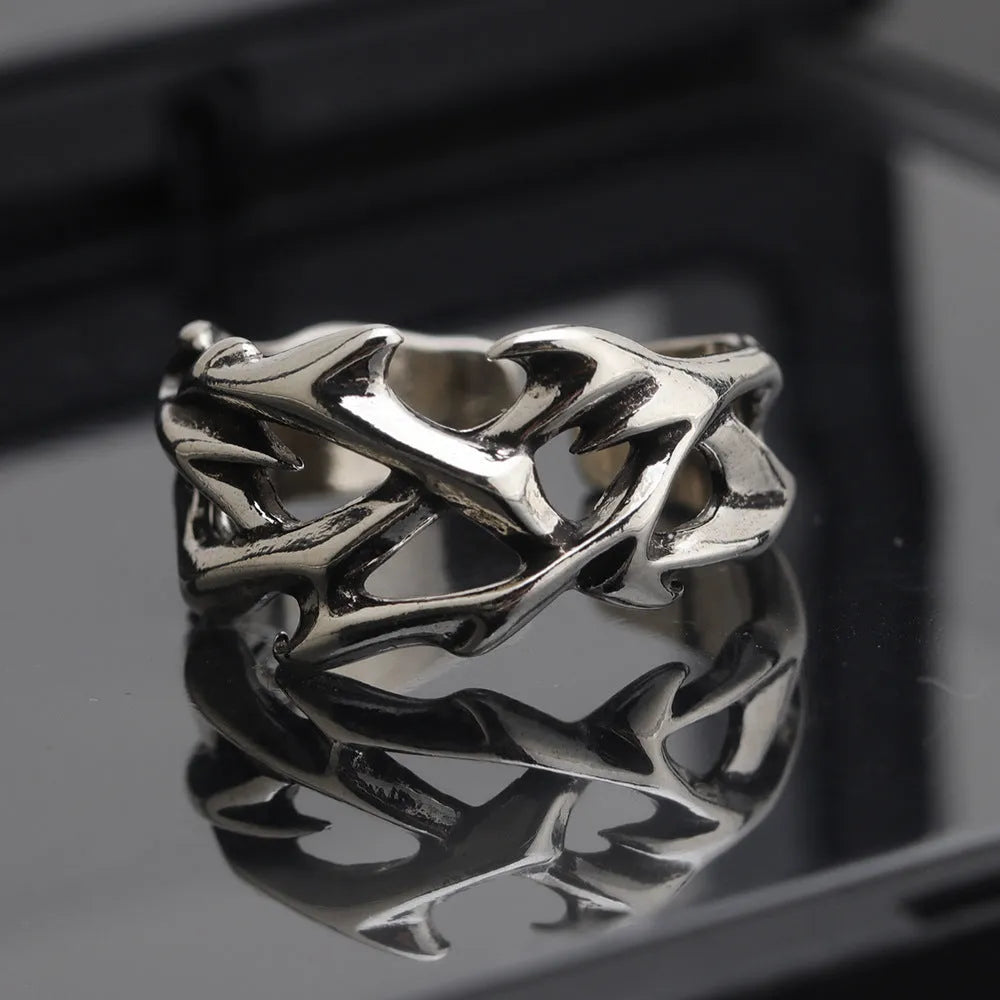 Copper men's ring with geometric thorn flower design and adjustable band in J2150 colour.