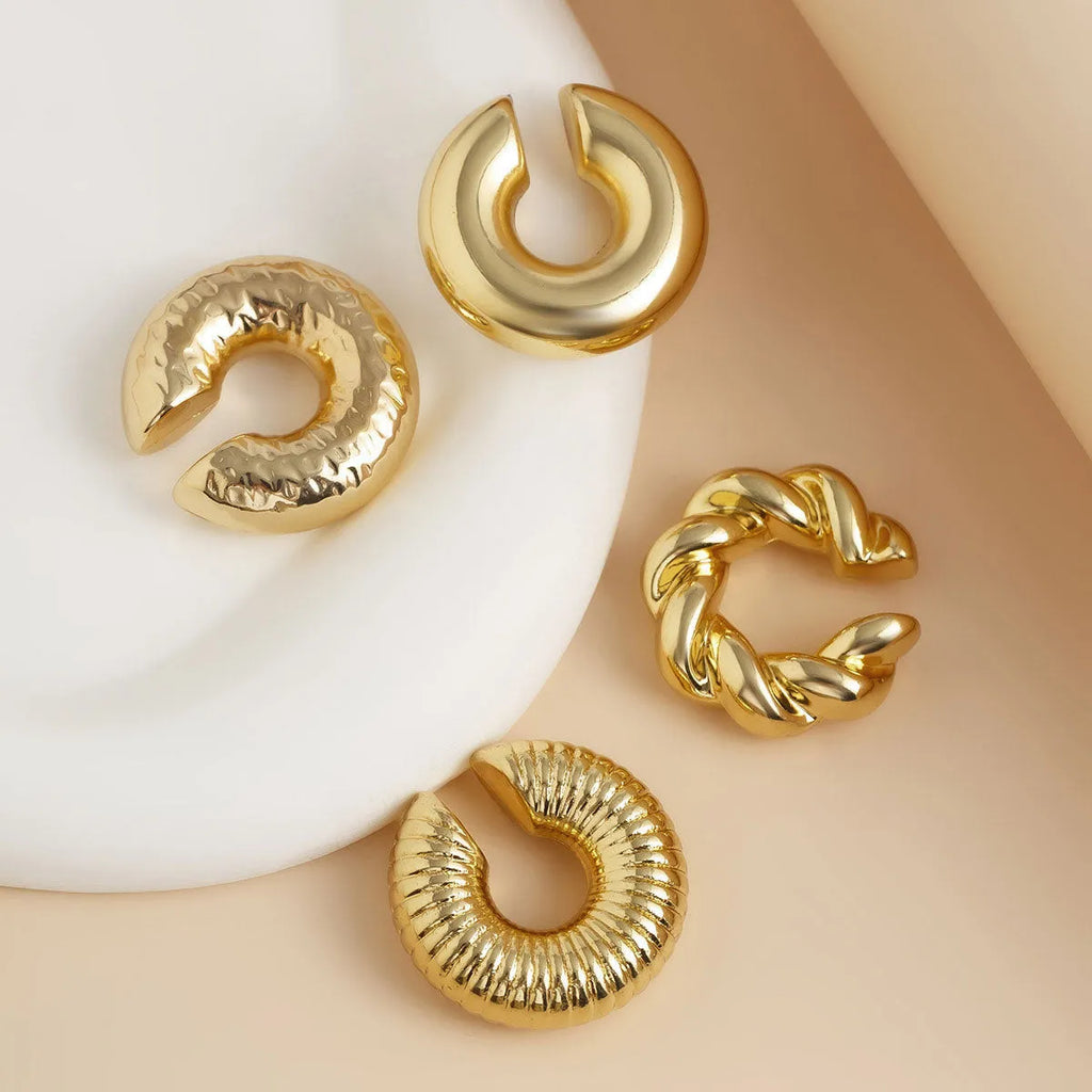 Set of four geometric gold and silver clip-on earrings for women without pierced ears.