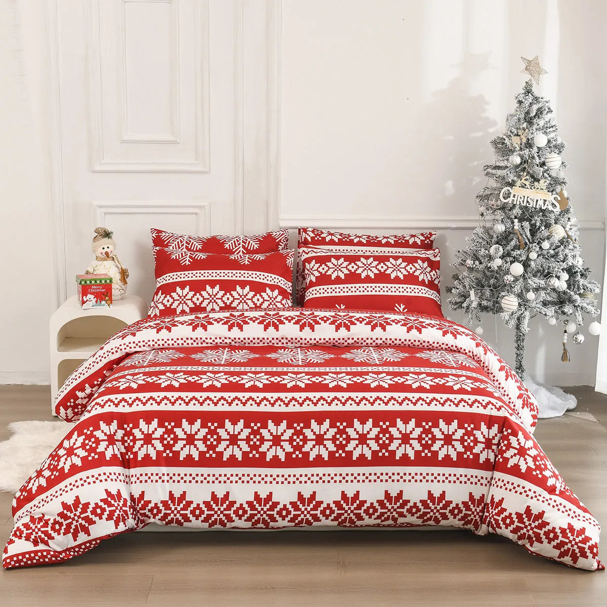 Red Christmas pattern three-piece bedding set with quilt cover and pillowcases on bed