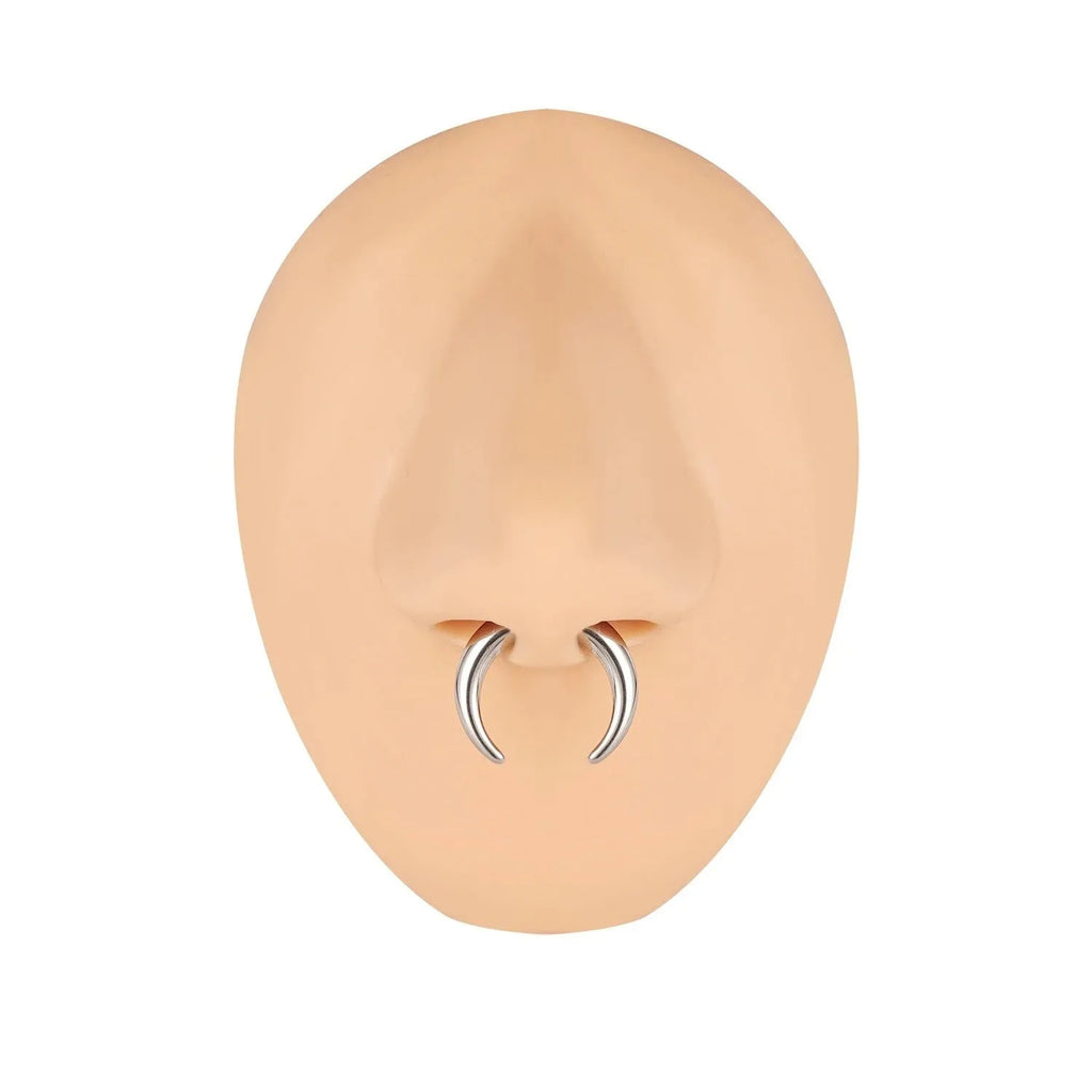 Black and steel coloured C-shaped nose ring with a buffalo horn centre on a grey background