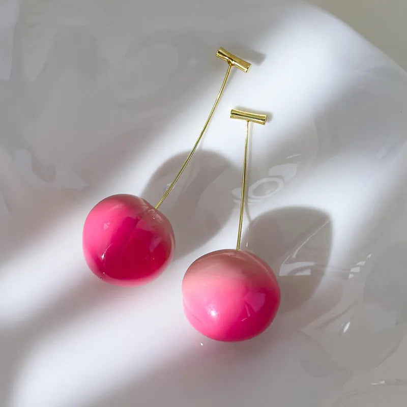 Acrylic peach fruit earrings with gold-tone earwires in small and large size options