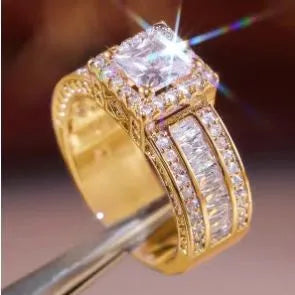 Geometric alloy fashion ring in gold or white colour on size display showing UK sizes 5-13