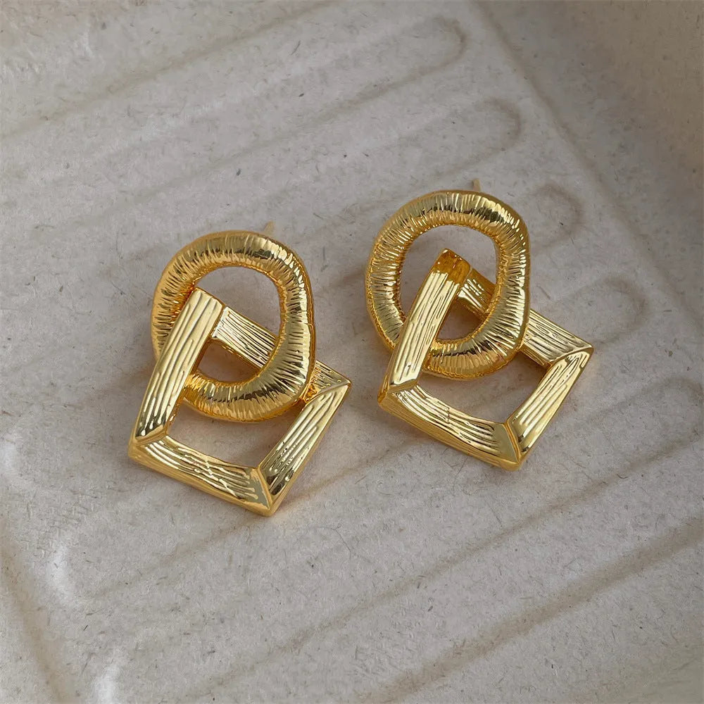 Gold and silver retro geometric copper drop earrings, 3.4cm long.