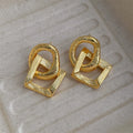 Gold and silver retro geometric copper drop earrings, 3.4cm long.