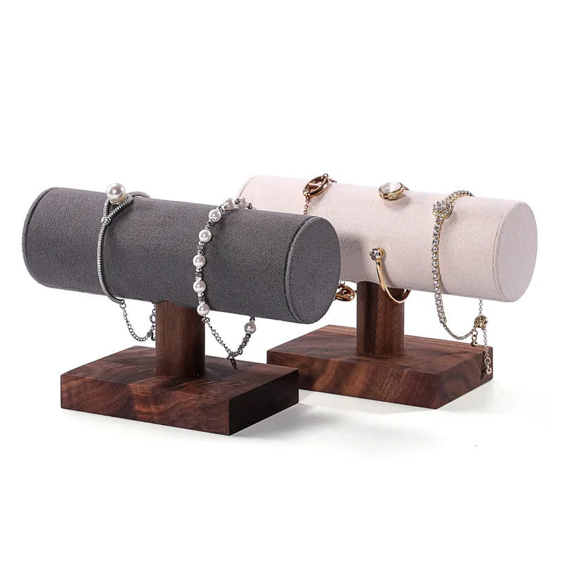 Walnut bracelet display stand with I-shaped solid wood frame and short cylinder, shown in beige velvet, dark grey, or white leather.