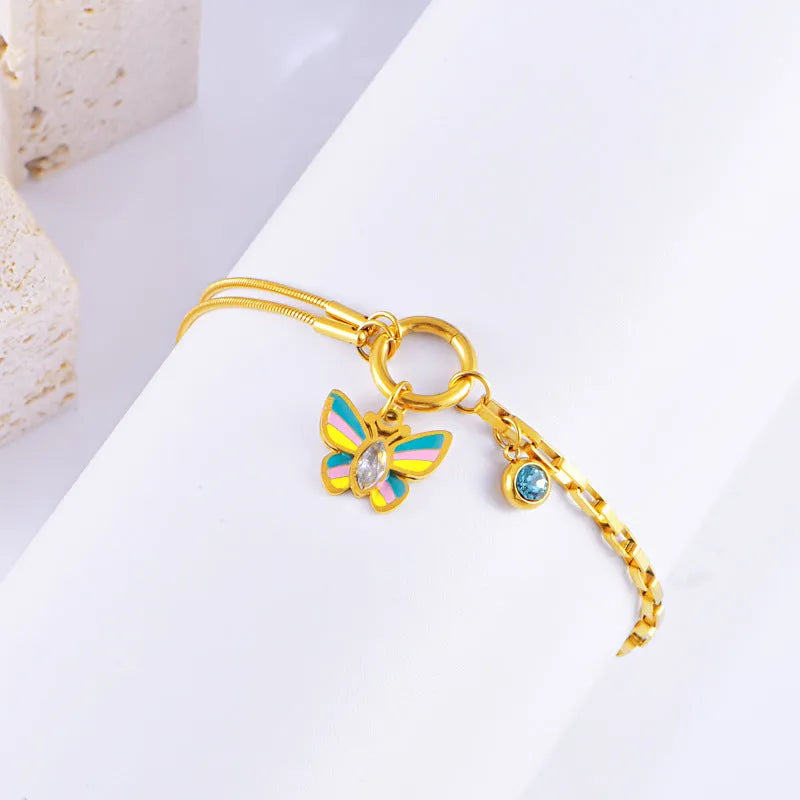 Gold epoxy butterfly jewellery set with necklace and bracelet on titanium steel snake bone chain