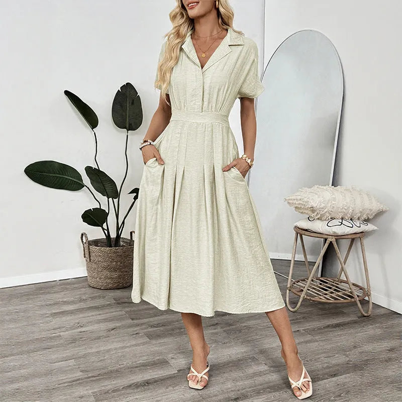 Light green twill shirt dress with lapel, fitted waist and commuter pockets