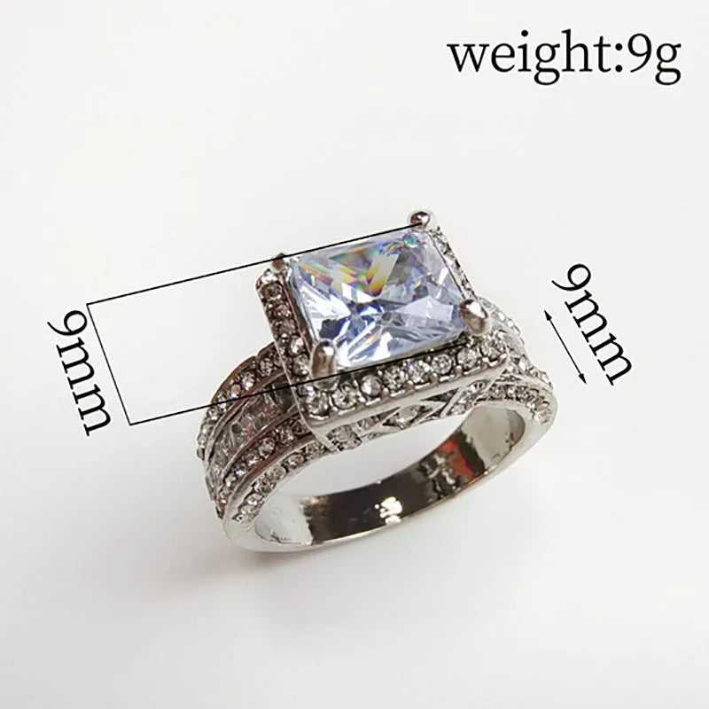 Geometric alloy fashion ring in gold or white colour on size display showing UK sizes 5-13