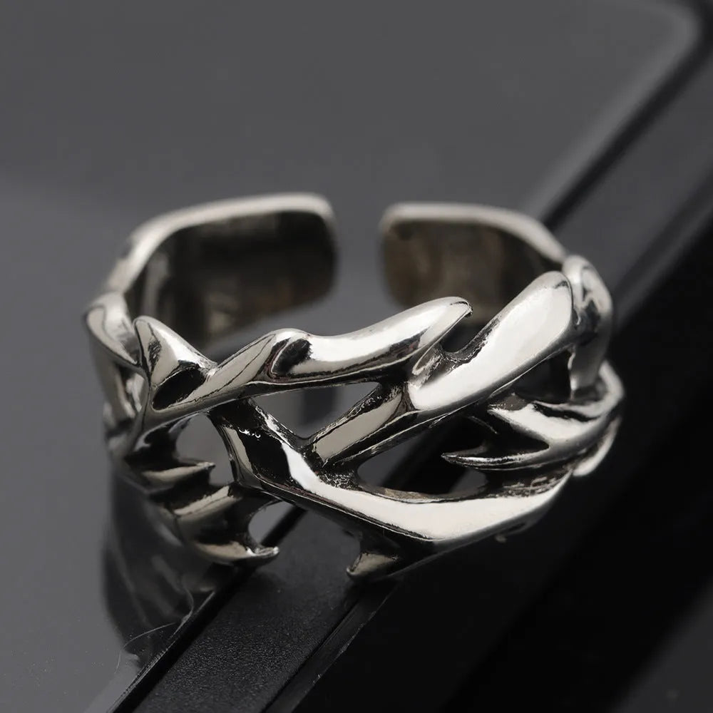 Copper men's ring with geometric thorn flower design and adjustable band in J2150 colour.