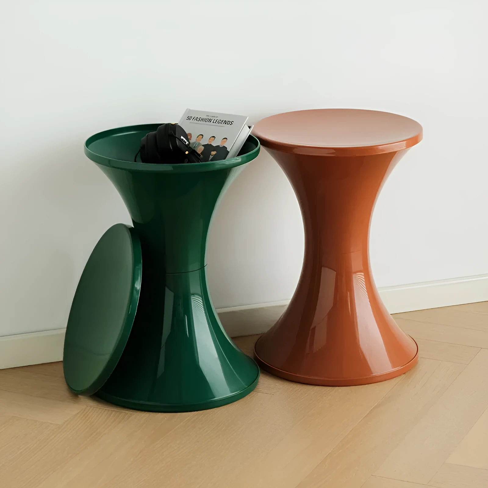 Plastic hourglass-style shoe changing stool in green, shown in a home entryway.
