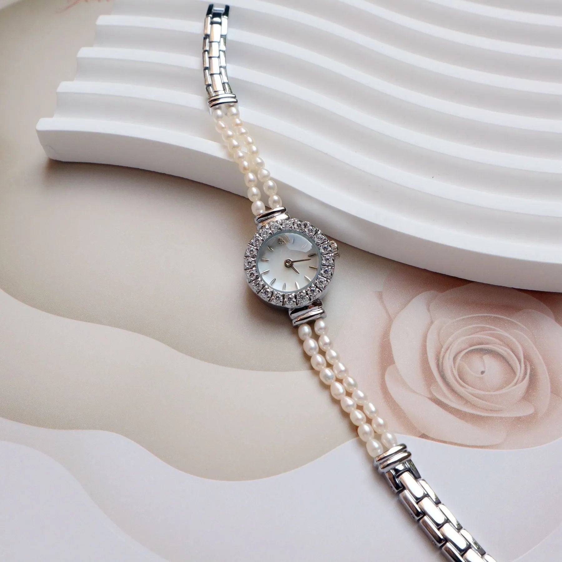 Women's light gold freshwater pearl bracelet watch with round dial on stainless steel strap